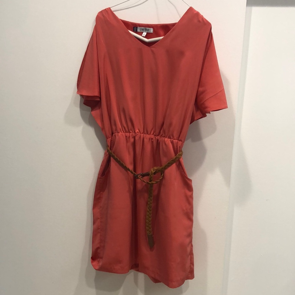Like new Jennifer Lopez dress. Size small. Front pockets and slit sleeves.